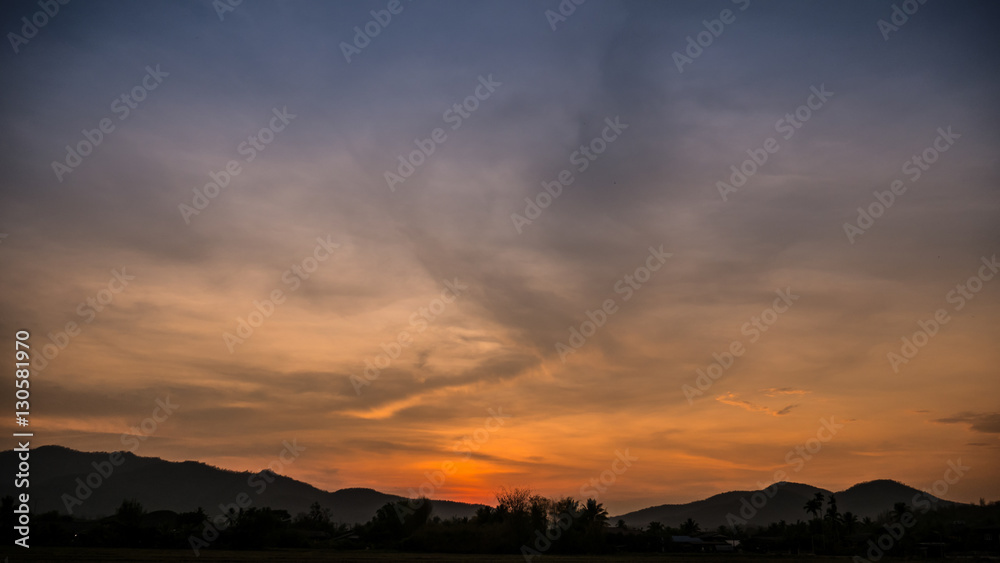 Sunset or sunrise with cloud and ray light on blue sky