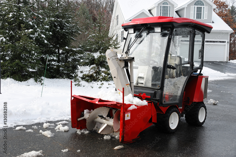 snow blower vehicle parking in residential area after snow Stock Photo