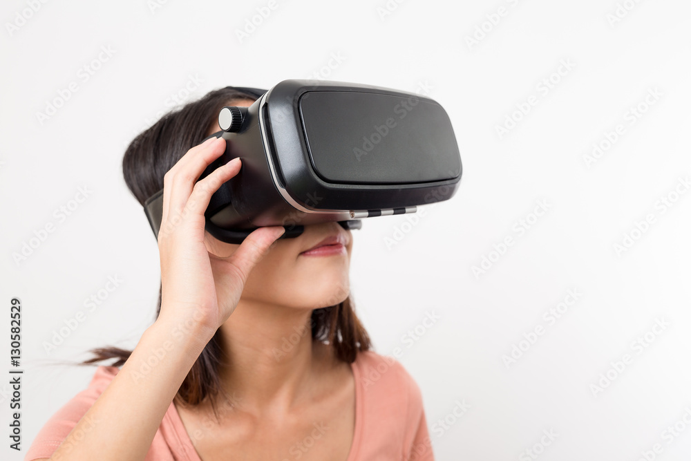 Woman getting experience using VR headset Woman getting experience using VR headset