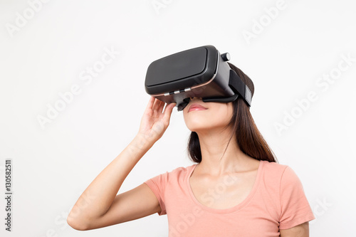 Young Woman Wearing Virtual Reality Headset © leungchopan