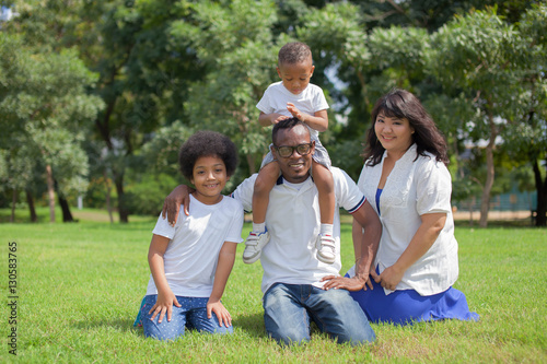 Happy diverse and mixed race family group photo in the park © twinsterphoto