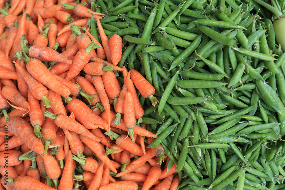 fresh carrots and green peas selling at the street shop fresh carrots and green peas selling at the street shop