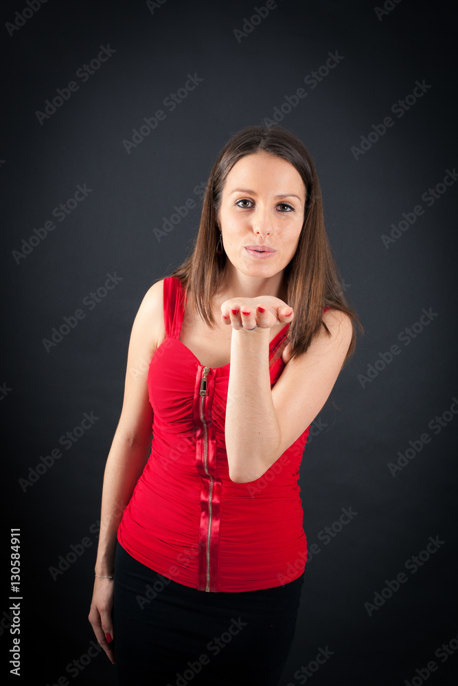 Beautiful woman doing different expressions in different sets of clothes: kiss