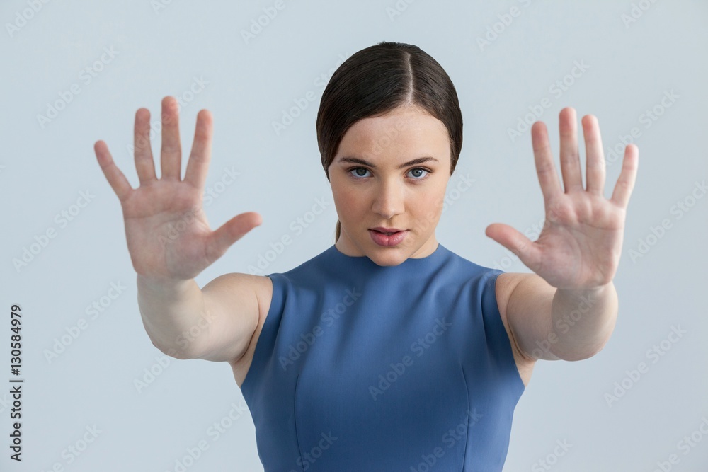 Beautiful woman pretending to touch a screen Beautiful woman pretending to touch a screen
