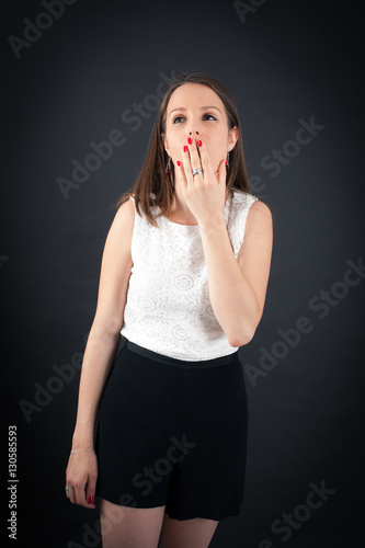 Beautiful woman doing different expressions in different sets of clothes: yawn