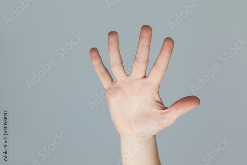 Hand of a woman touching an invisible screen © WavebreakMediaMicro