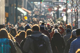 Crowd of people walking on a street