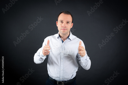 Handsome Man doing different expressions in different sets of clothes: gun sign