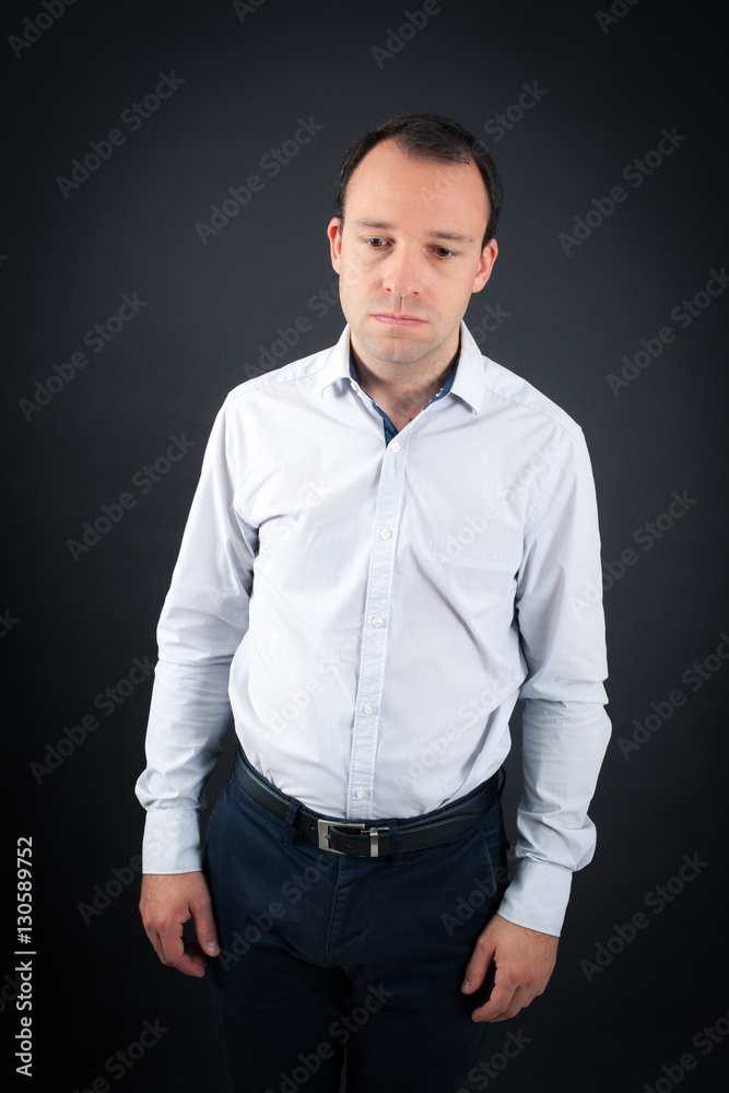 Fototapeta premium Handsome Man doing different expressions in different sets of clothes: tired