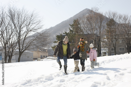 Family walking in the snowfield