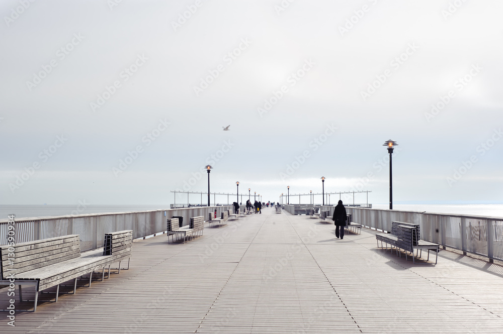 Coney Island beach Pier, Brooklyn NY. Cloudy weather, no sun. 