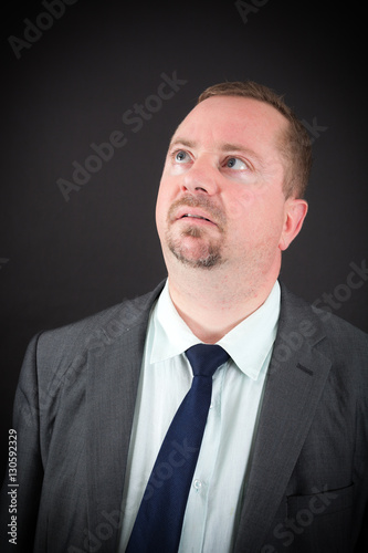 Handsome man doing different expressions in different sets of clothes: thinking