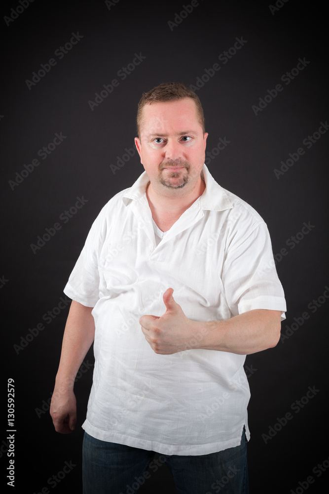 Handsome man doing different expressions in different sets of clothes: thumbs up Handsome man doing different expressions in different sets of clothes: thumbs up