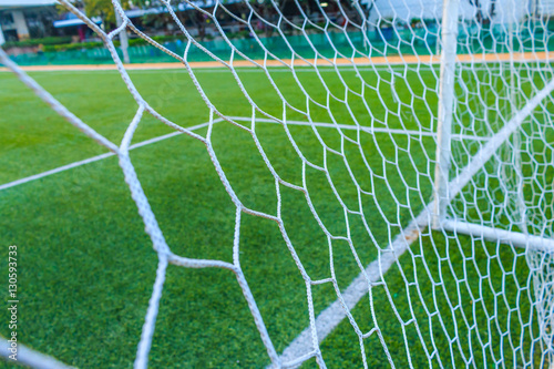 The nets of football goal with field artificial grass
