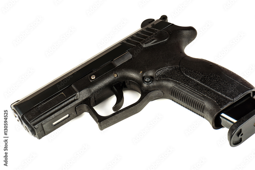 The black gun (pistol) on a white background close up. Isolate.