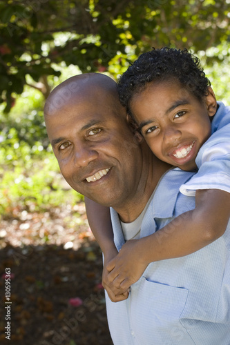 African American father and son spending time together.