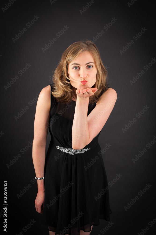 Beautiful woman doing different expressions in different sets of clothes: kiss Beautiful woman doing different expressions in different sets of clothes: kiss