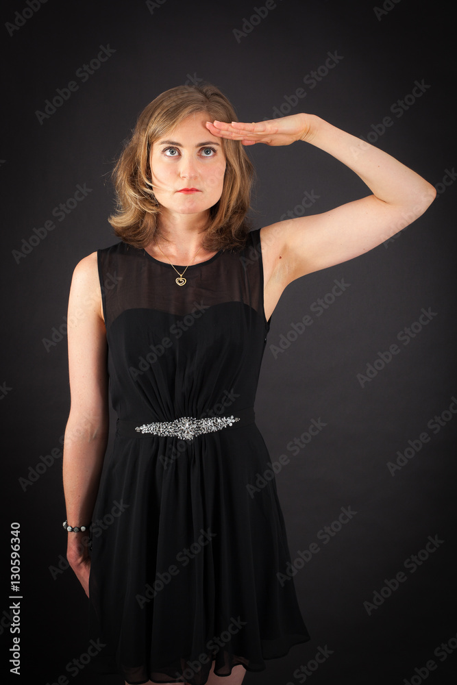 Beautiful woman doing different expressions in different sets of clothes: at attention Beautiful woman doing different expressions in different sets of clothes: at attention