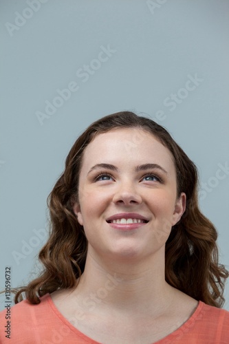 Smiling woman looking upward