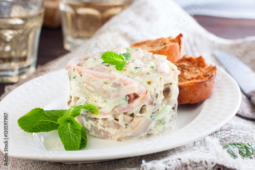 Salad with ham and mushrooms, and toast with mayonnaise, horizontal