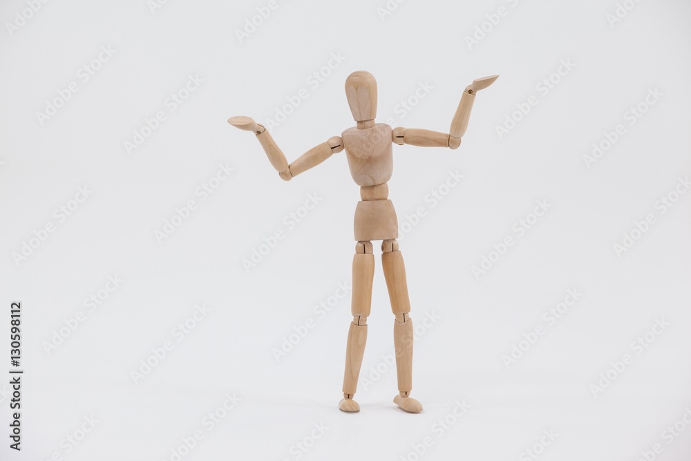 Wooden figurine standing with arms spread Wooden figurine standing with arms spread