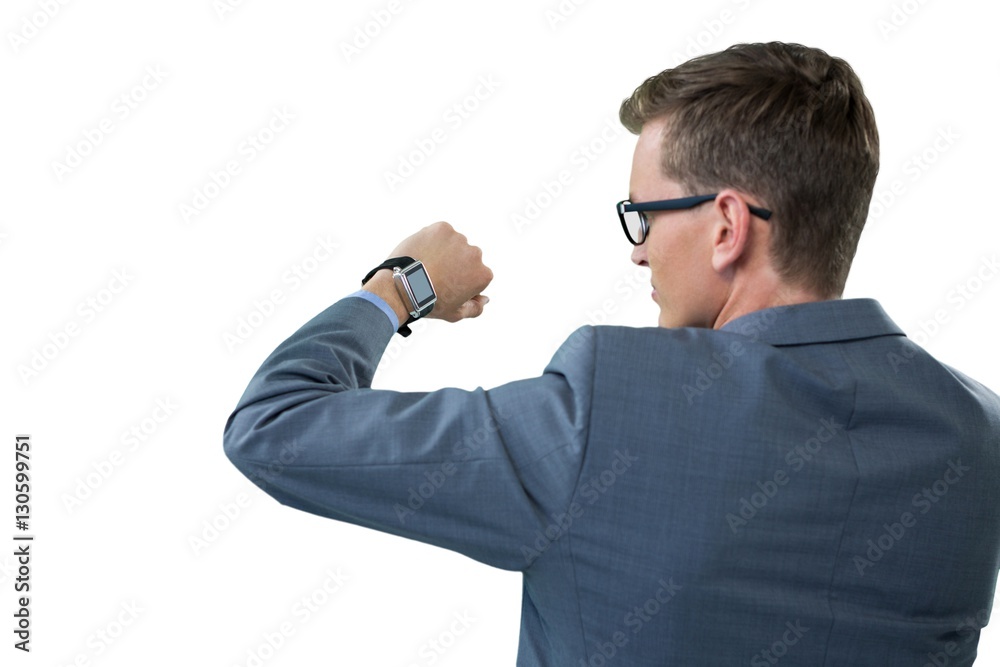 Businessman checking his smart watch Businessman checking his smart watch