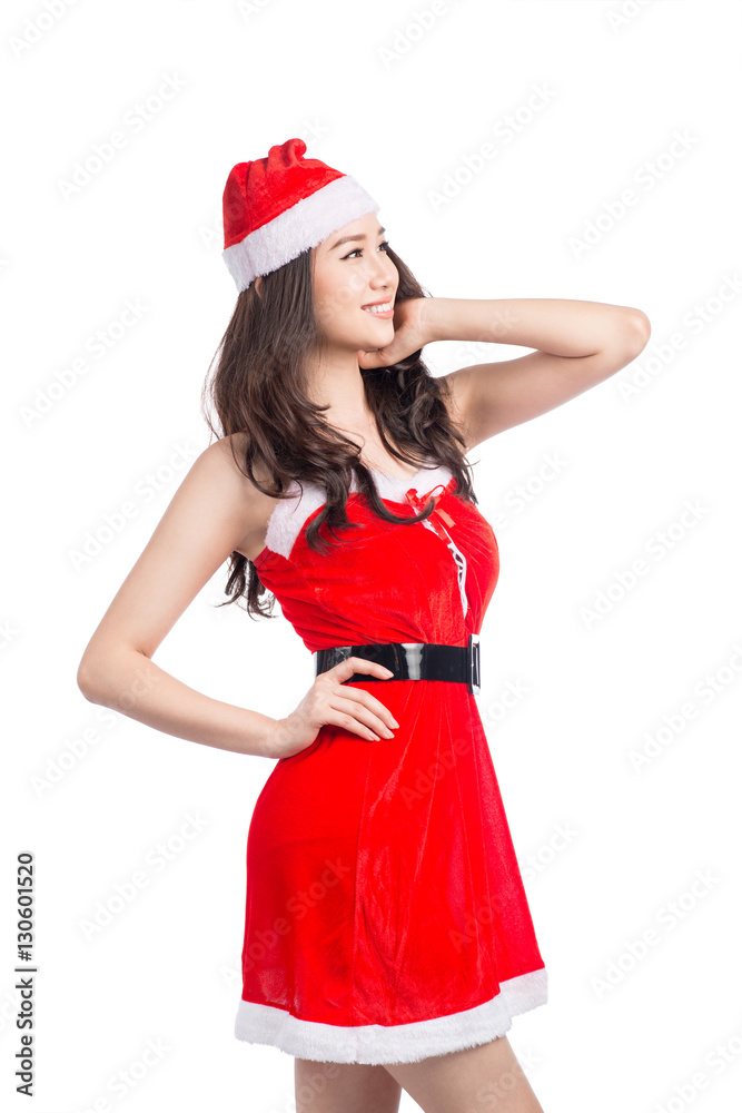Christmas Woman. Beauty Asian Model Girl in Santa Hat isolated o Christmas Woman. Beauty Asian Model Girl in Santa Hat isolated o