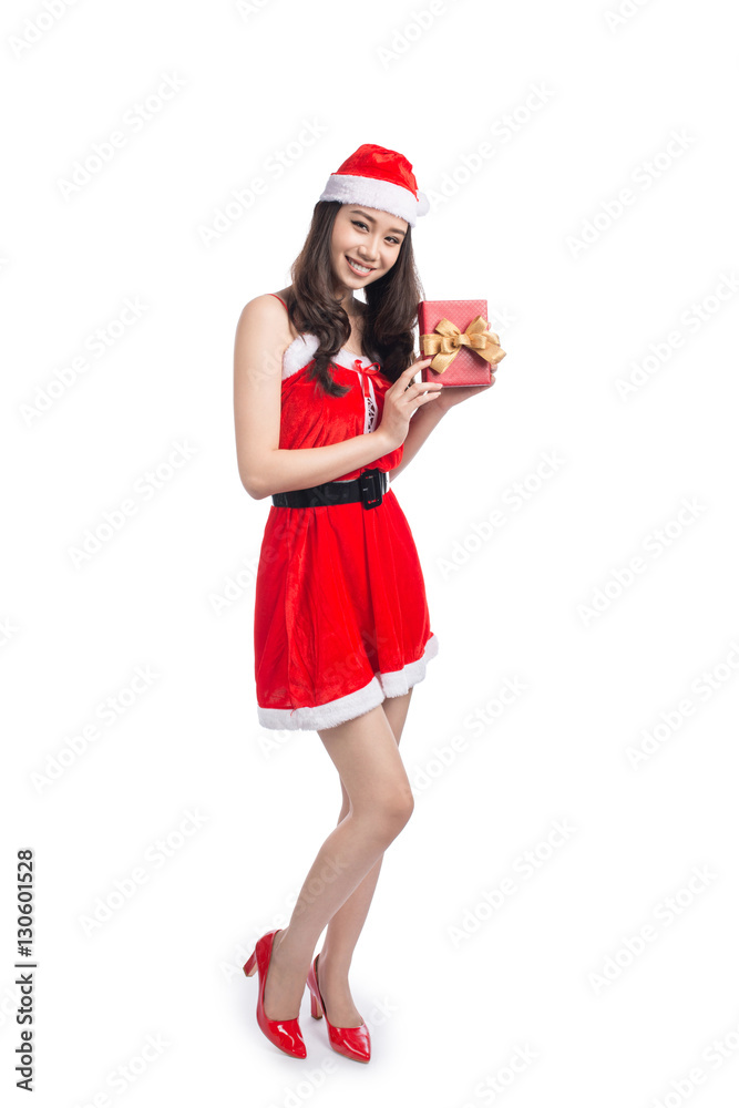 Obraz premium Full length portrait of a asian woman in santa claus cloth holdi