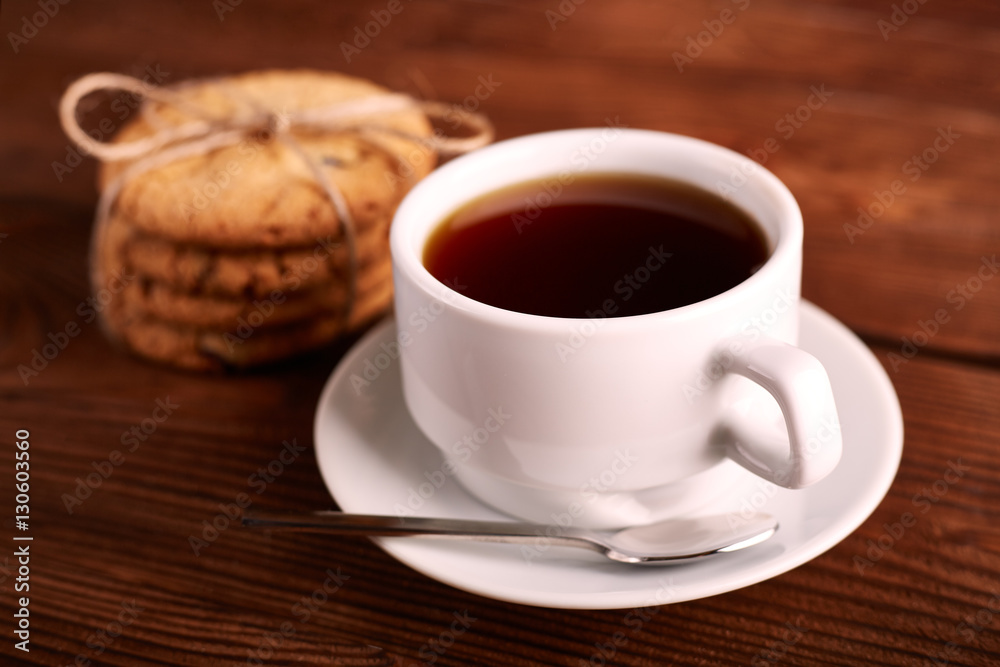 Coffee and Homemade cookies with chocolate. Handmade Chocolate cookies and cup of espresso on wooden table. Pile of delicious chip cookies. Christmas cookies. Biscuits. Oat biscuits. Coffee and Homemade cookies with chocolate. Handmade Chocolate cookies and cup of espresso on wooden table. Pile of delicious chip cookies. Christmas cookies. Biscuits. Oat biscuits.