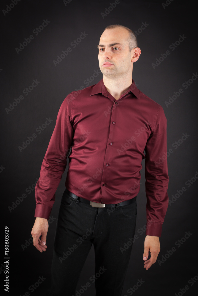 Fototapeta premium Handsome Man doing different expressions in different sets of clothes: bored