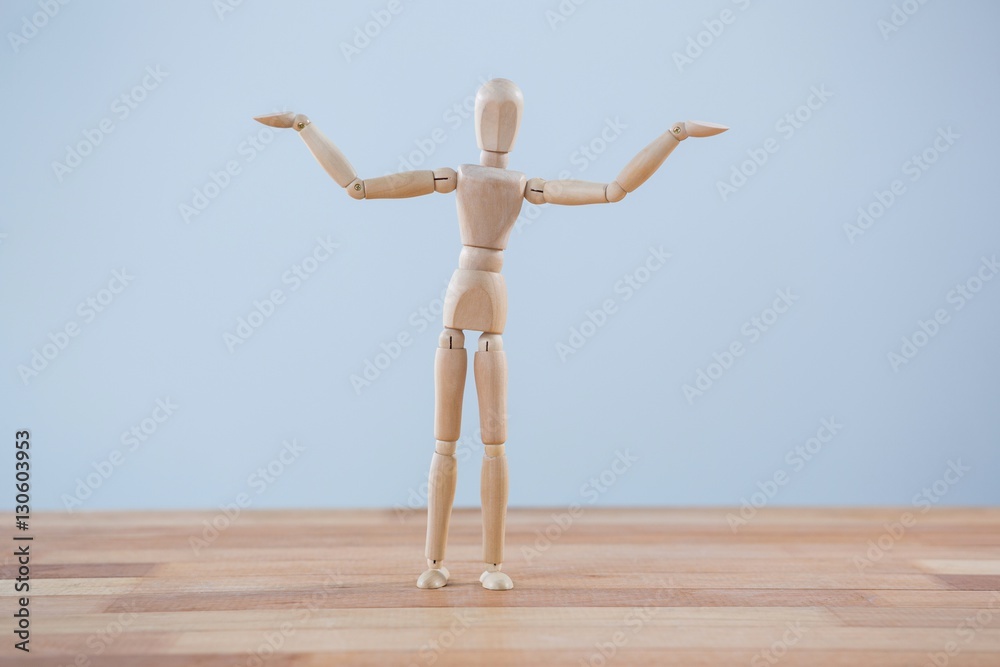 Wooden figurine standing with arms spread Wooden figurine standing with arms spread