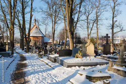 cementery with tombstones and crosses, cemetery in winter landscape 