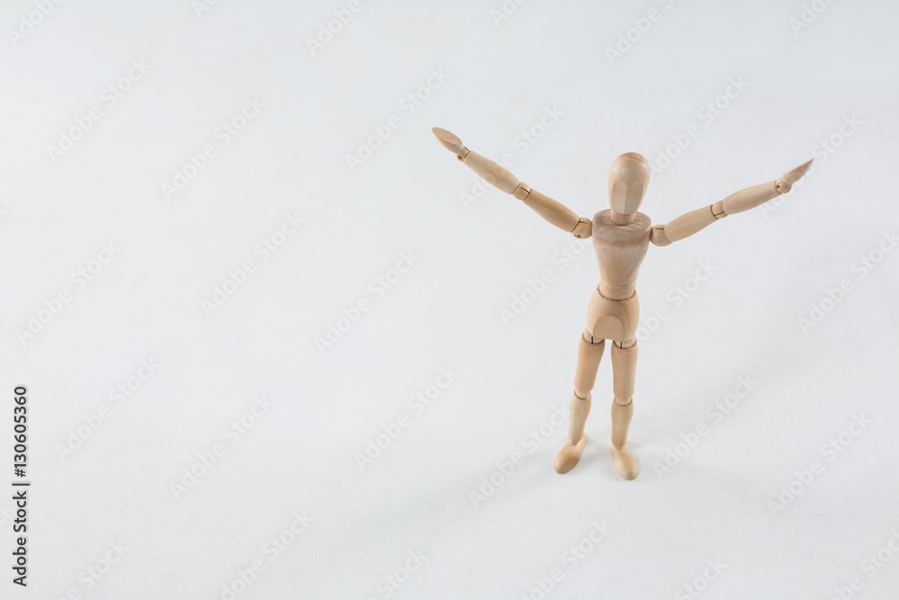 Wooden figurine standing with arms spread Wooden figurine standing with arms spread