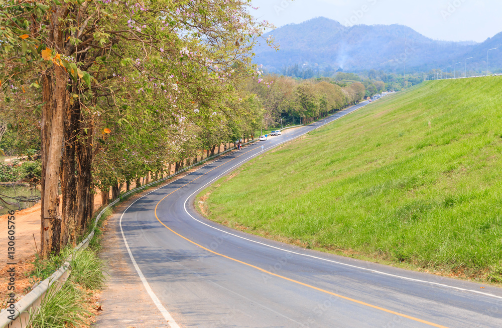 roadway for transportation with mountain and green grass, transp roadway for transportation with mountain and green grass, transp