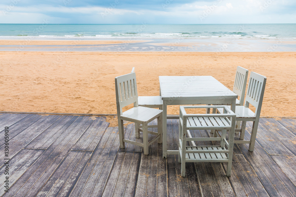 wood floor and seaside table with beach and sea background