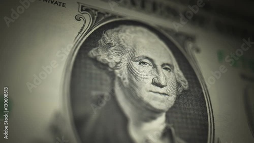 One Dollar Bill, Washington (25fps). Camera moves down the portrait of President George Washington on an uncut crisp sheet of U.S. $1 bills, freshly minted from a printing press.