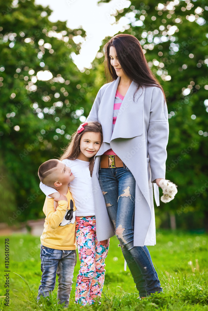Fototapeta premium Mother with daughter and son in the meadow