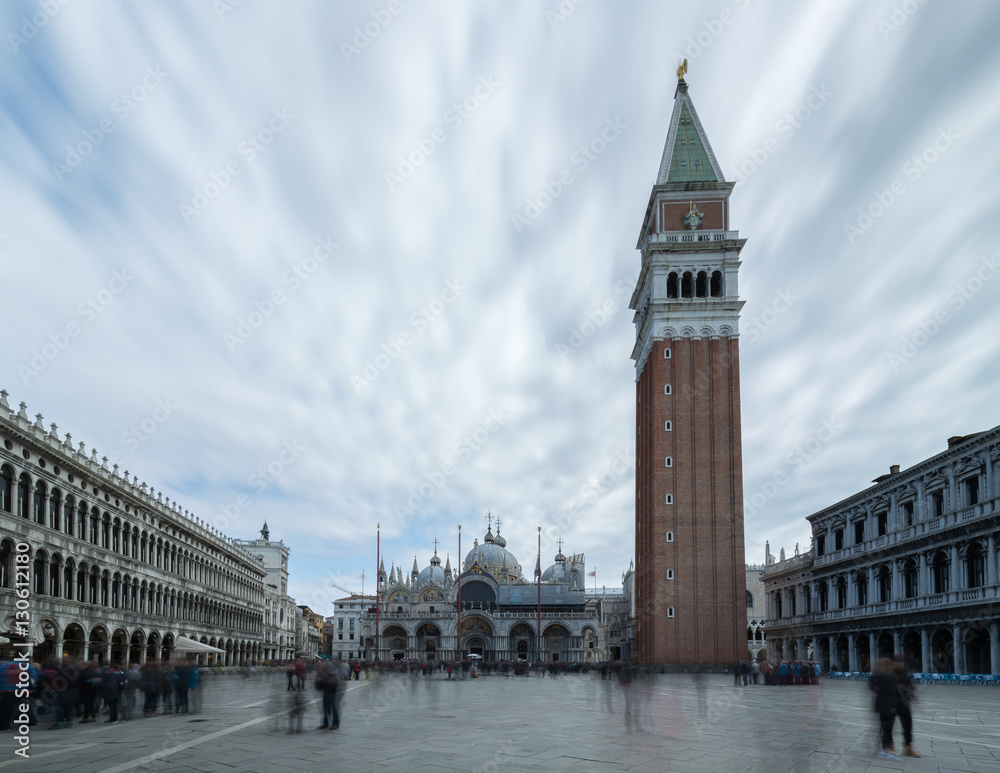 Long exposure shot of the Campanile in St Marks Square (Piazza San Marco) in Venice showing the crowds blurred out.