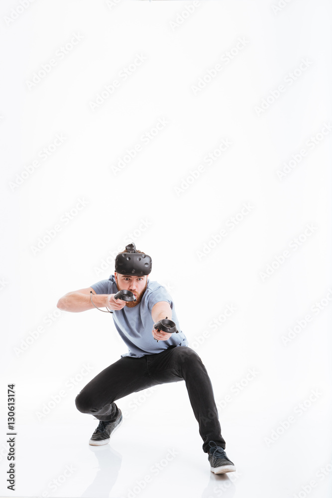Playful man wearing virtual reality device Playful man wearing virtual reality device