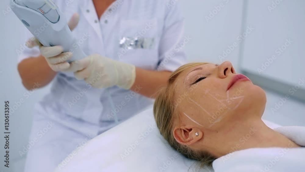 Beautician making procedure of lifting in clinic Beautician making procedure of lifting in clinic