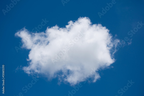 Single white clouds on blue sky