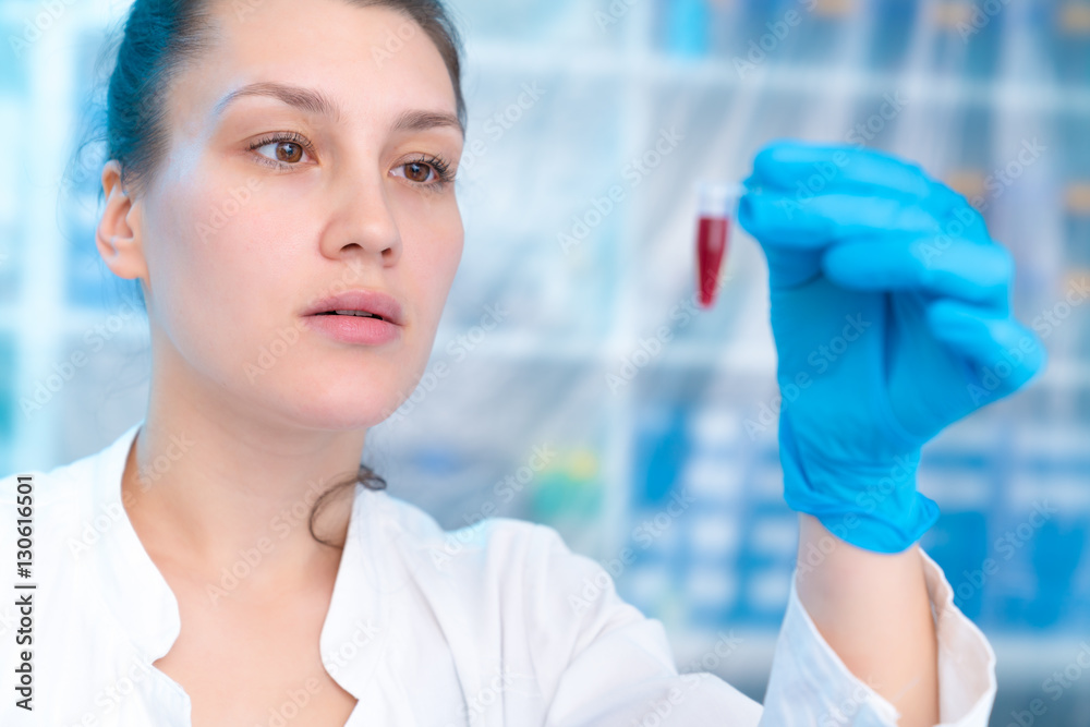 Woman technician with multipipette in genetic laboratory PCR research. Student girl use pipette. Young female scientist loads samples for DNA amplification by PCR Woman technician with multipipette in genetic laboratory PCR research. Student girl use pipette. Young female scientist loads samples for DNA amplification by PCR
