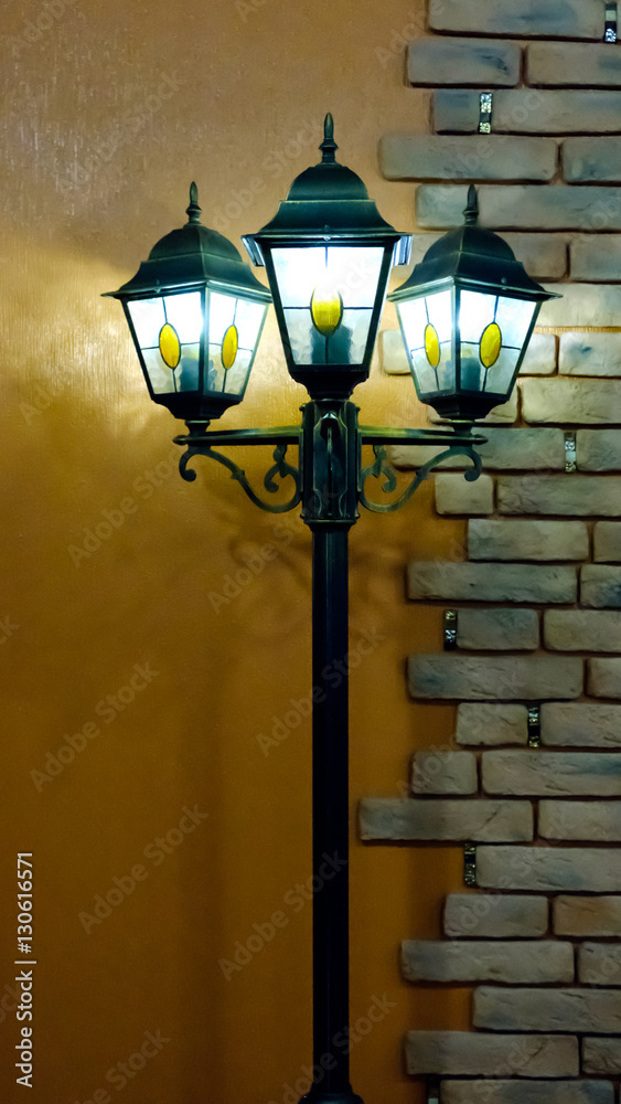 the lamps near brick wall
