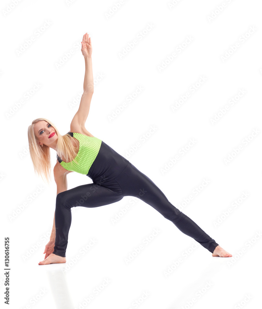 Attractive female gymnast exercising at studio Attractive female gymnast exercising at studio