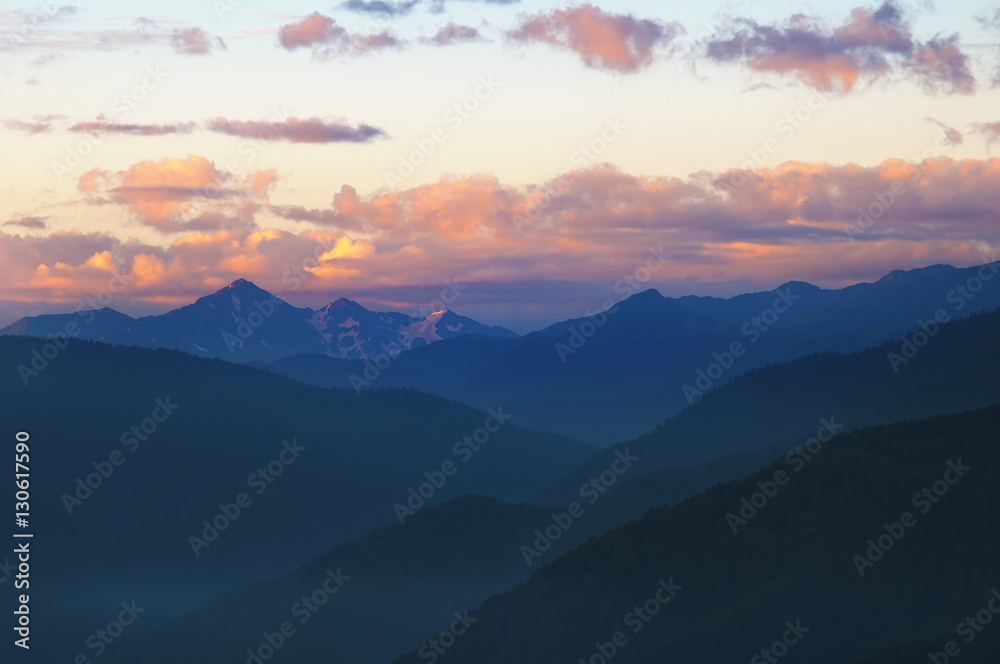 Fototapeta premium Mountains after sunset with beautiful sky and clouds.
