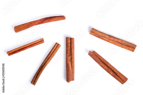 Fotografia Cinnamon sticks, top view, paths