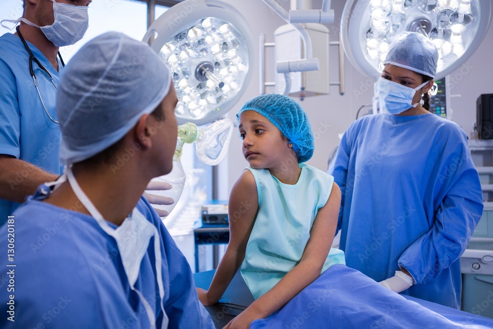 Doctor interacting with patient in operation room