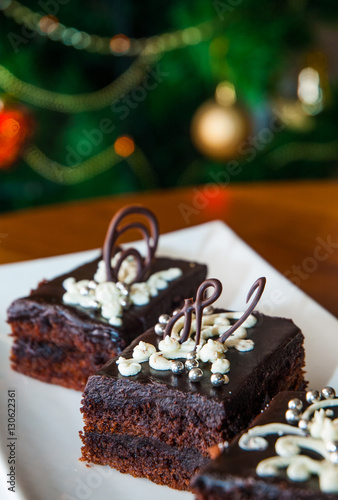 cake on table against the background of Christmas tree