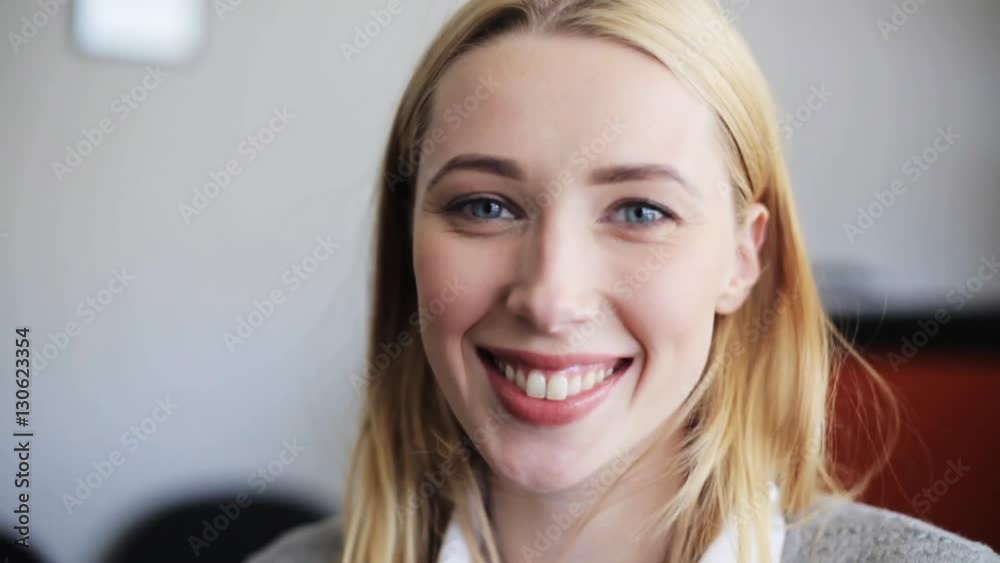 face of happy smiling young woman