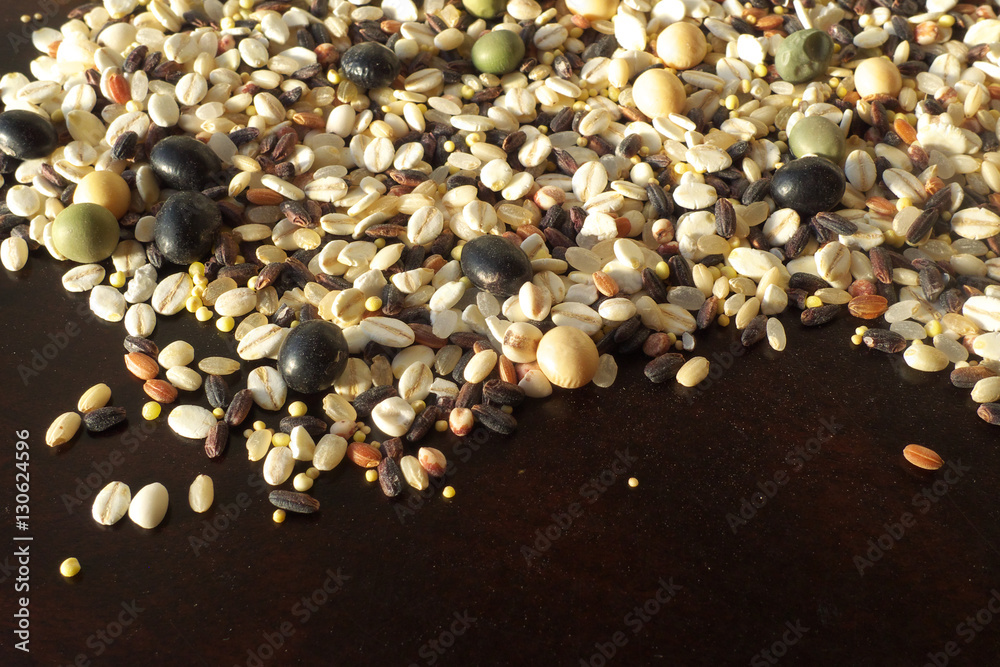 Fototapeta premium Cereals and beans on wood background